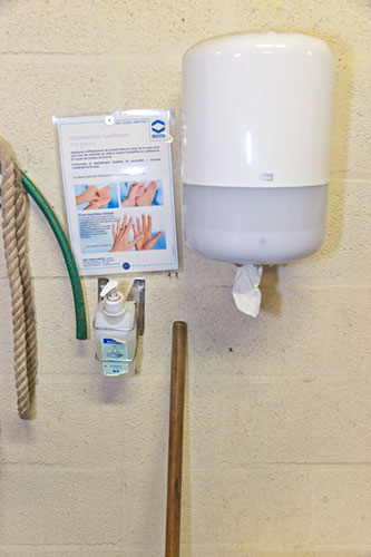 Soap dispenser and disinfectant in the corridors of the hospital unit