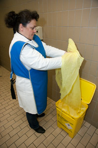 Dispose of the yellow apron in the yellow bin.