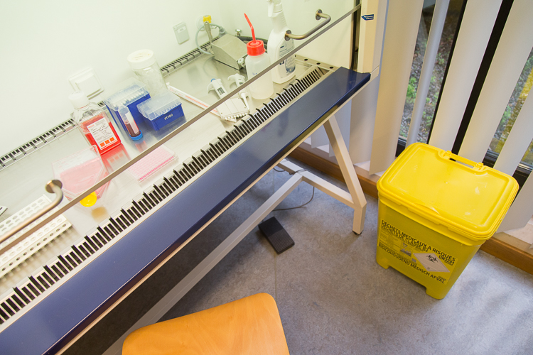 There is always a yellow waste container close to the biosafety cabinet