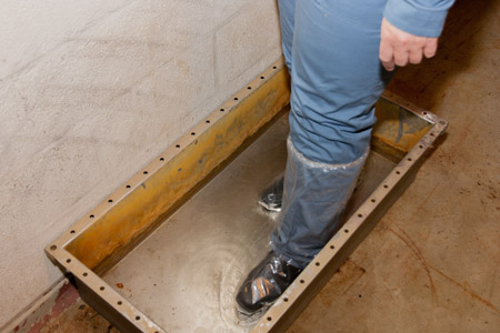 Walk through the foot bath located on the inner side of the Clinic 