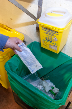 Dispose of packaging and non-contaminated paper towels in the black bins lined with plastic bags